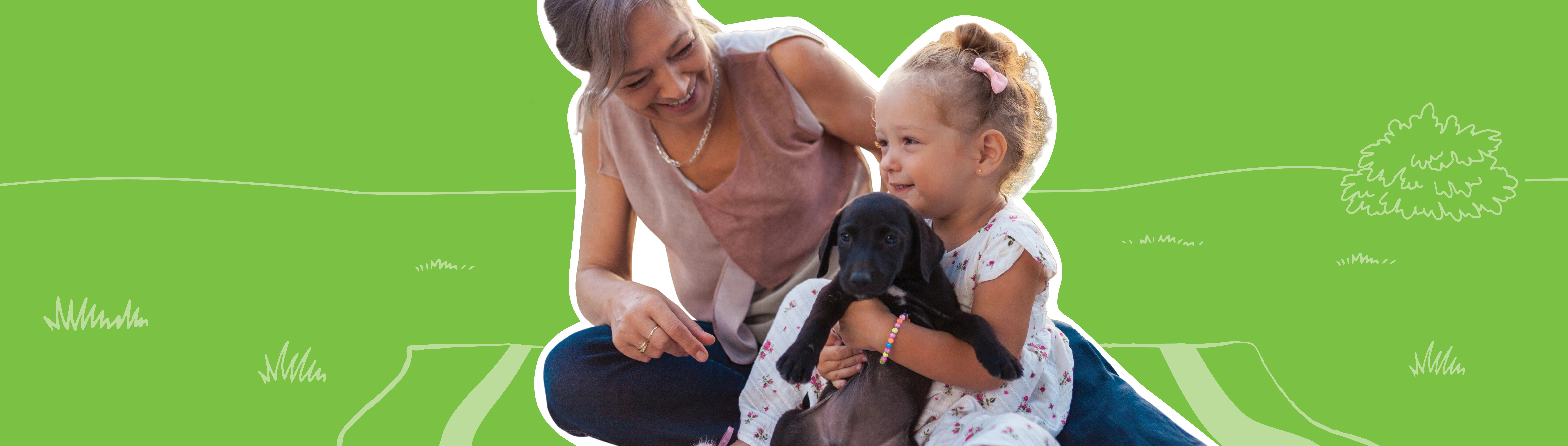 woman with a girl holding a puppy