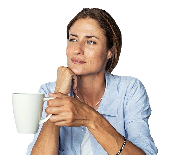 woman in kitchen with cup of espresso